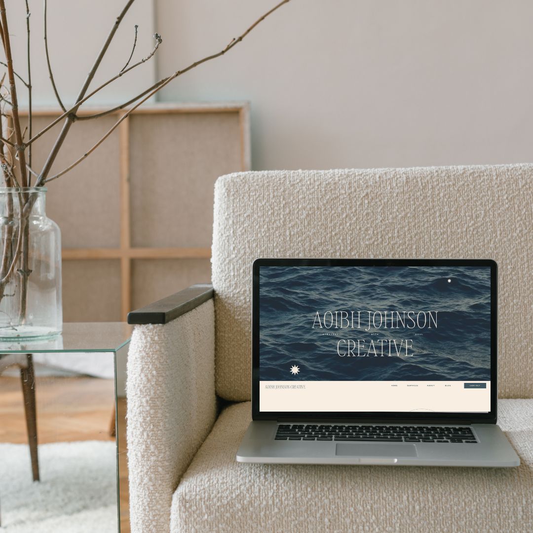 Home page of a showit website design for a copywriter on a cream boucle sofa
